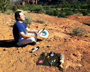 Man drumming on the red rocks-Sedona Vortex Adventures