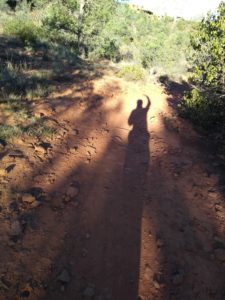 shadow of a person hiking on a trail-Adobe Jack Trail