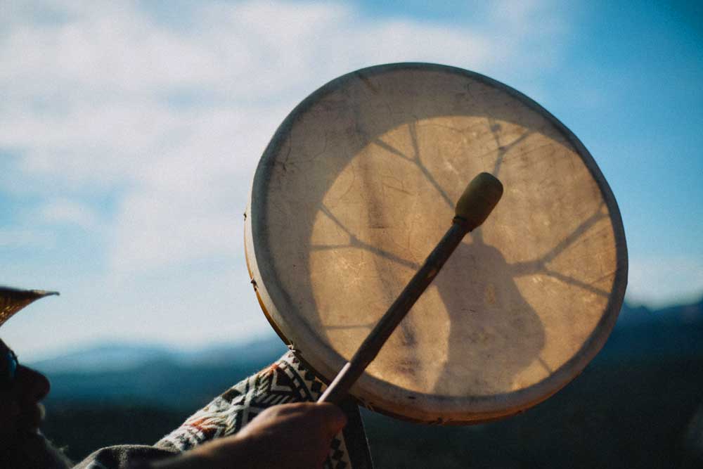 drum-shamanic-group-retreat-sedona drum being played during a sedona vortex adventure