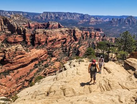 two people hiking on sedona slickrock
