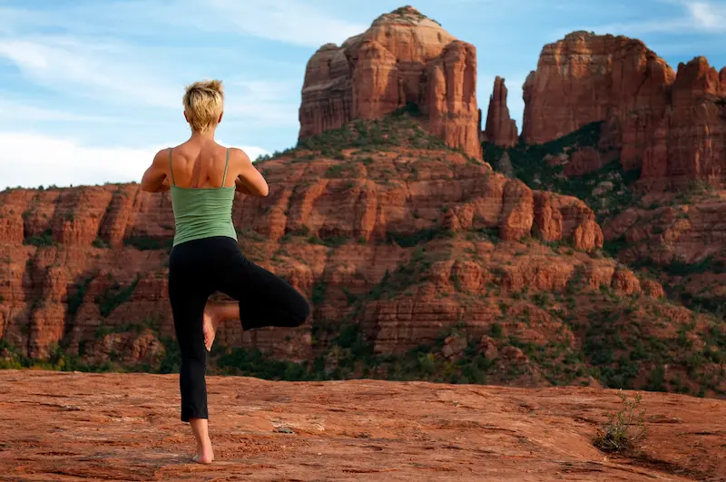 woman-mindful-catheral-spiritual-retreat (1) woman does yoga at cathedral rock with sedona vortex adventures